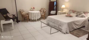 furnished room with a private  bathroom.