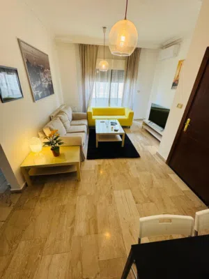 2-Bedroom Fully-Furnished Apartment with Balcony for Rent in Deir Ghbar, Amman - Jordan