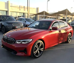 1500 AED/MONTH- 0% DP - BMW 330I (2022) LOW MILEAGE- بي ام 330 بلون احمر قابل للتقسيط عبر البنك