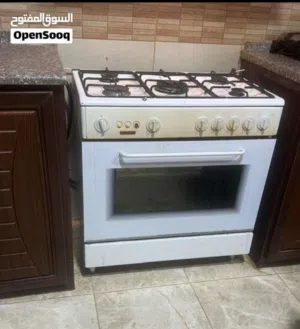 غاز ابيض 5 عيون مع فرن لون ابيض الماني ..
