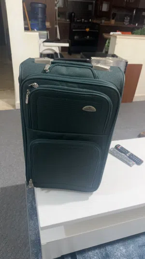 شنطة سفر موديل سامسونايت حجم وسط