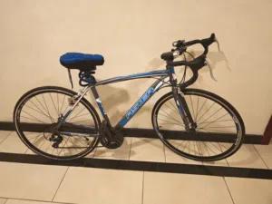 Used road bike - alloy frame with drop handlebars,