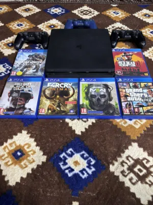 PS4 slim 1 Tera with 3 controllers and 6 cd games