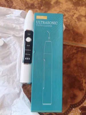 جهاز تنظيف الأسنان وإزالة الجير بالموجات فوق الصوتية (Ultrasonic Tooth Cleaner).