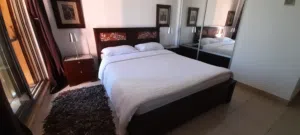 Double Bed, 2 Matching Bedside Cabinets and a 4 draw tall unit.