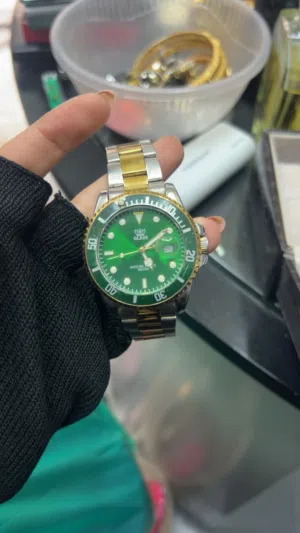 ساعة يد رجالية بعلبة من الفولاذ المقاوم للصدأ مقاس 40 ملم وسوار ذهبي/فضي اللون من OLEVS السعر:10