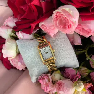 Michael Kors rectangular gold-tone bracelet watch with a chain-link style band and white dial