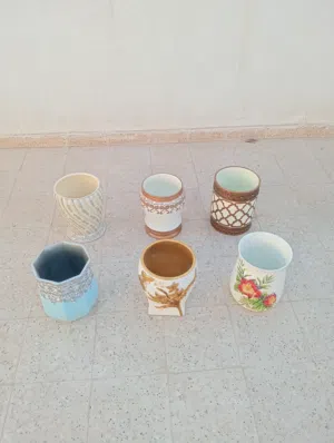 centre point ( splash )  ceramic pots 1.5 kg each .