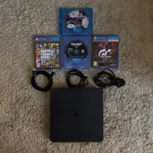 PS4 Slim 1TB + 2 Controllers + 4 Games Excellent Condition  Clean & Working Perfectly