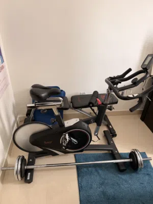 Used Indoor Exercise Bike with Free Weights and Bench - Good Condition