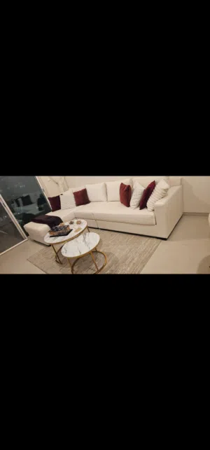 I'm selling an elegant velvet white corner sofa with coffee tables