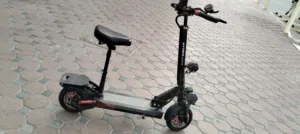 Electric scooter with a seat for sale   New, only very lightly used  - In perfect condition wi