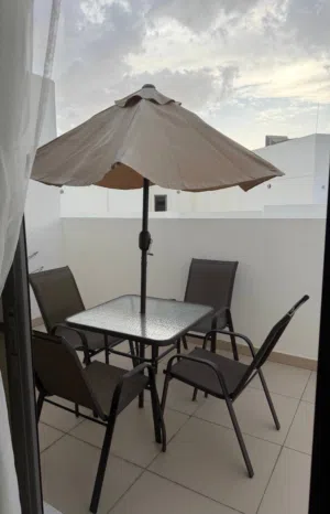 Table, 4 chairs, umbrella
