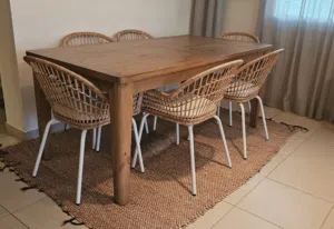 Homes R Us Solid Wood Dining Table + 6 IKEA Rattan ChairsBeautiful dining set featuring a solid wood