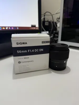 Sigma 56mm f1.4 عدسة