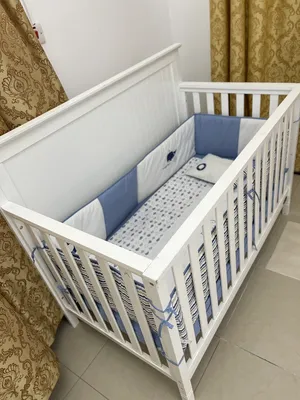 Baby shop wooden cot with Raha spring mattress and baby shop oscillating chair