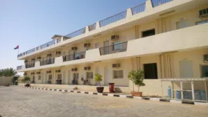 سكن عمالي ( غرف ) للايجار في مدينة العين الصناعية