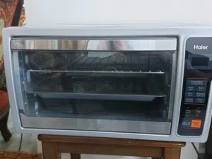 فرن كهربائي ديجيتال Haier بحالة الوكالة ونظيف جداً (مع مروحة وشواية)