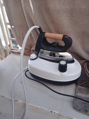 مكوى بخار مع قاعدة tiDA
