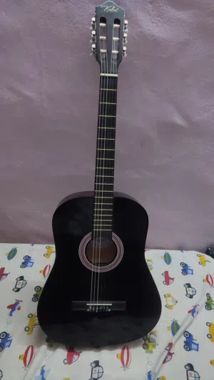 Classic guitar for sale , completely new and rarely used . Neck tuner and strings all fine .