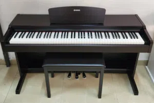 The Yamaha YDP-131 is an entry-to-mid-level digital piano designed for realistic acoustic touch and