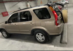 هوندا CR-V 2004 مستعملة بحالة ممتازة، لون ذهبي، مرخصة، 7 مقاعد، أوتوماتيك