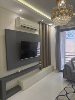 Two bedrooms and a living room + maid’s room with attached bathroom + balcony