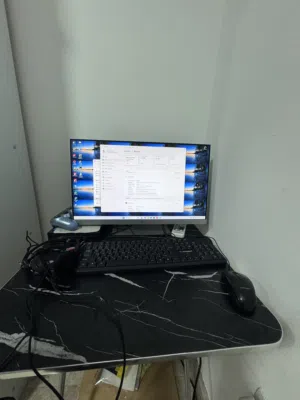 Full setup of desktop 24” with pc and table , everything in picture  60 OMR