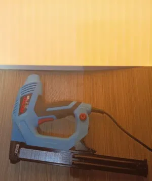 variable drive power electric nail gun . used once or twice as new and with nails