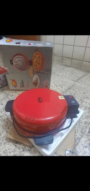 تنور كهربائي وصانعة كليجة