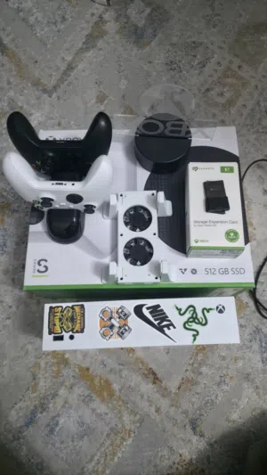 Xbox series s with 1tb storage and 3 controller and 1 dual fan cooler and 2 rechargeable battery