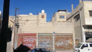 عمارة 3طوابق وتسوية مع 3محلات