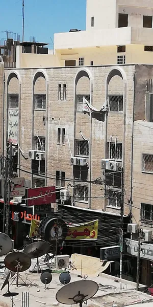 عماره - وسط السوق - شارع بغداد - مقابل عامر الخياط- 5 طوابق - مصعد