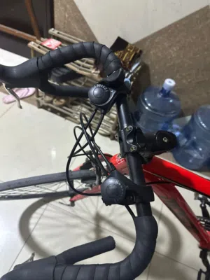 road bike new used for 31 days with light tor wheels color red location:ajman bustan