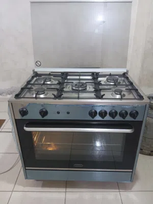فرن غاز توفينا ايطالي  مواصفات ستنالس ستيل سلفر قياس 90×60  مستعمل بحاله الجديد فل سيفتي