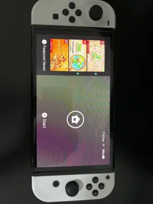 Nintendo switch OLED WITH FULL EQUIPMENT AND PAIRLY USED