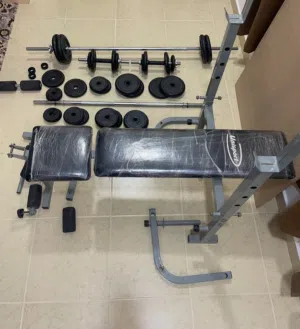 للبيع حديد اوزان 55 كيلو مع جهاز تمارين
