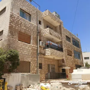 بنايه سكنيه استثماريه في موقع حيوي جبل الحسين قرب مستشفى الامل والعيادات للبيع بسعر استثنائي 400الف