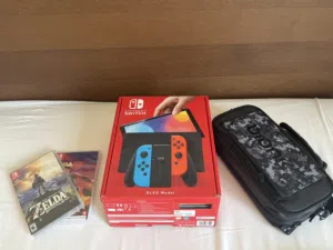 Nintendo switch OLED new + screen protector applied + Zelda game + 1 game + carry case