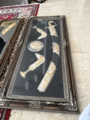 Very old antique picture frame with a sword, two daggers and a a shield very old Kuwaiti