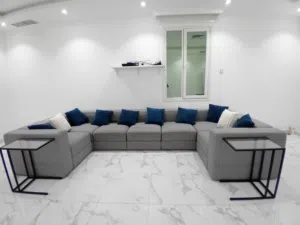 Used sectiontional with built in storage including 2 glass end tables all for 30 KWD