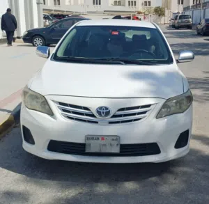 Corolla 2012 , white color MANUAL TRANSMISSION