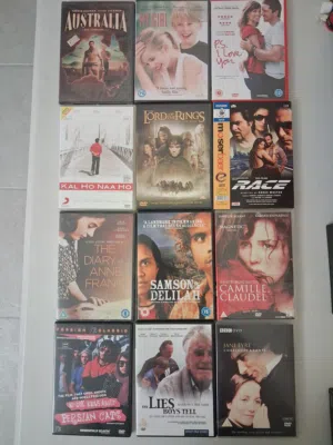 12 assorted DVDs ( some new )