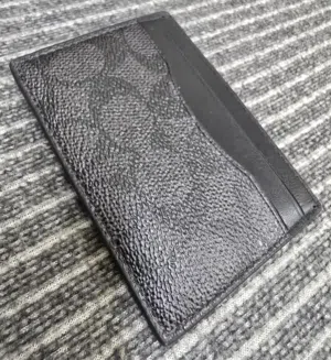 COACH Men's Money Clip Card Case in Signature Canvas.