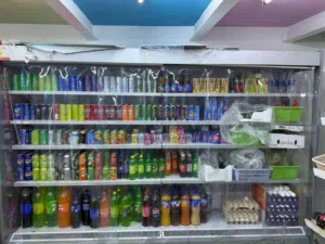 supermarket display fridge/freezer (like a glass-door freezer or open chiller used in shops).