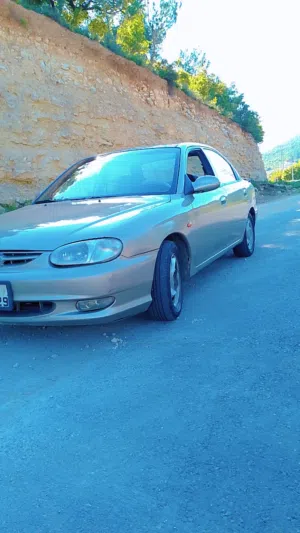 كيا سيفيا موديل 1999 كوشوك امامي جديد خلفي بحاله جيده ماتور وقير فحص قير اتوماتيك  مكيف حامي بارد شغ