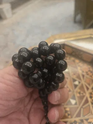 مسباح بولينق اسود دائري 47 خرزة حجم 12 ملي بتمليكة وزن وكثافة ورنه