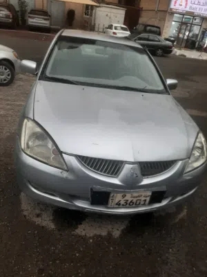 سياره لانسرللبيع موديل 2004 لون فضي السعر قابل للمساومه