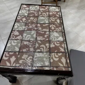 Dark brown table is for sale .