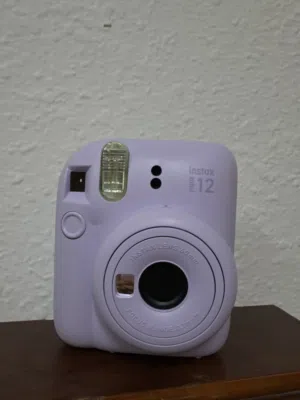 Instax Mini 12 Camera – Like New + Case + Photo Album